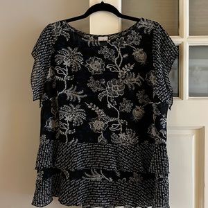 Like new Cabi top with attached cami, hemline appears to be layered